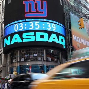 NEW YORK, NY - MAY 17:  Cars drive by the Nasdaq headquarters on May 17, 2012 in New York City. Facebook will list their IPO on Nasdaq on Friday morning with an opening price of $38 per share.  (Photo by Justin Sullivan/Getty Images)